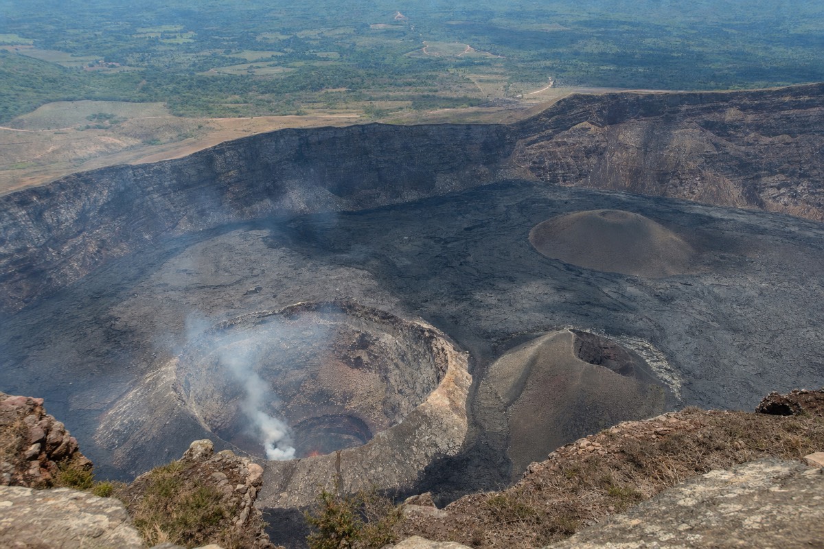 The glowing Santiago Crater lava lake inside Masaya Volcano's caldera at night
